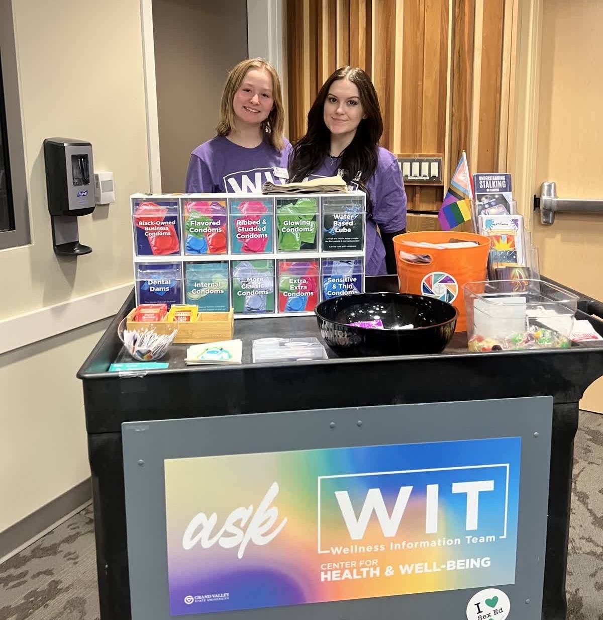 Says "WIT Peer Education" with photo of peer educators behind WIT cart